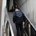 ISAMU KATAYAMA BACKLASH x RESURRECTION (イサムカタヤマバックラッシュ x リザレクション) VINTAGE-PROCESSING JERSEY L/S TOPS プリント ロングTシャツ BLACK (ブラック) MADE IN JAPAN (日本製) 2024春夏新作のイメージ
